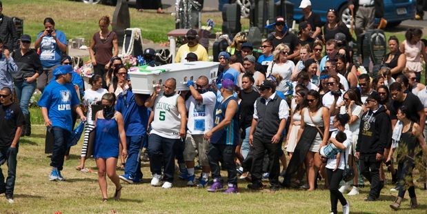 Mourners carry Sentry Taitoko to his grave in the Manukau Memorial Gardens.