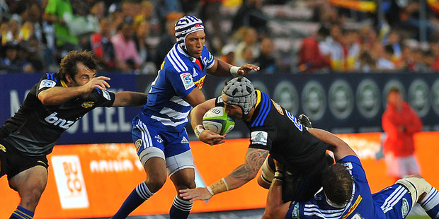 Blade Thomson is tackled during the Hurricanes' defeat to the Stormers. Photo / Getty Images