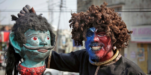 A Hindu devotee dressed as a demon takes part in a Shivratri festival dedicated to the worship of Hindu god Shiva. Photo / AP