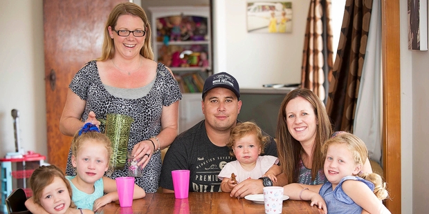 Stephanie Hawthorne (standing) - with Mark and Lara Utatao and children (from left) Esmae, Cleo, Frankie and Isla - has noticed attitudes to nannying services changing. Photo / Chris Loufte