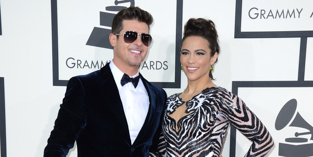 Robin Thicke, left, and Paula Patton have announced they are separating. Photo/AP