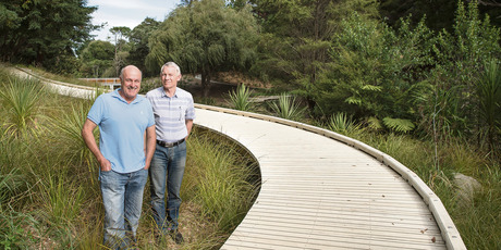 Chris Wiffen (left) and Rex Holmes, joint managing directors at Timspec, by the boardwalk made with Accoya timber at La Rosa Reserve in Green Bay. Photo / Supplied
