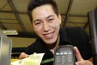 Papamoa Beach Four Square senior staff member Simon Chuah was excited to discover the store had sold a winning ticket. Photo/George Novak Papamoa Beach Four Square senior staff member Simon Chuah was excited to discover the store had sold a winning ticket. Photo/George Novak