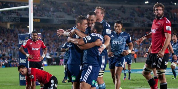 Super Rugby: Blues celebrate Jackson Willison's try against the Crusaders at Eden Park, Auckland. February 2014 New Zealand Herald Photograph by Richard Robinson.