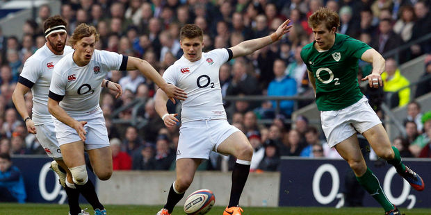 England's Owen Farrell (centre) vies for a loose ball with Ireland's Andrew Trimble (right) during the Six Nations Rugby Union International match between England and Ireland. Photo / AP