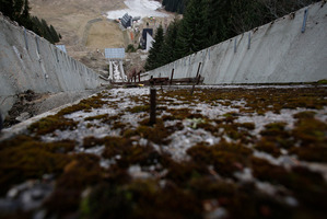 Feb. 21 2014 photo of the abandoned ski jumping facility covered in moss at Mt. Igman near Sarajevo. Wartime destruction and negligence have turned it into a painful reminder of better times.
