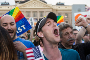 Demonstrators including Christopher Bullock, center, celebrate after hearing that Arizona Governor Jan Brewer was going to veto SB1062. Photo / AP