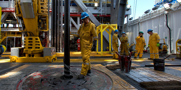 Workers on the rig floor of the Anadarko drillship the Noble Bob Douglas, 160km off the coast of New Plymouth. Photo/ Brett Phibbs