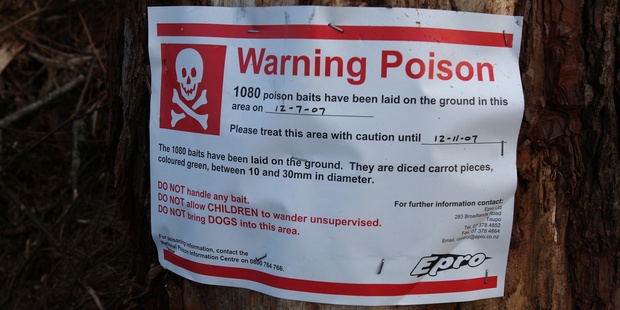 Warnings of 1080 poisoning are a familiar sight in bush and forests and many people complain of the risk to dogs. Photo / AP
