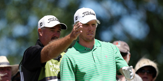 Andrew Dodt, Australia, rigt and his caddy talk tactics. Photo / Dianne Mason.