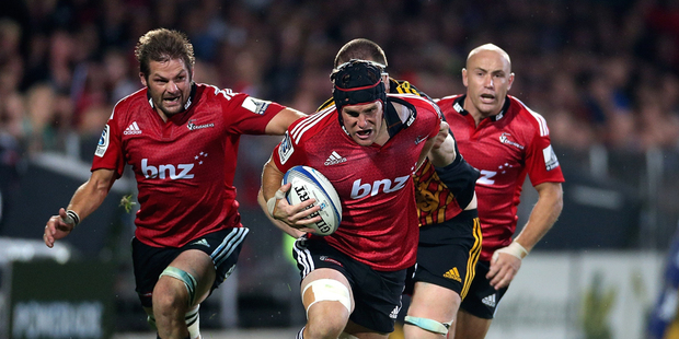 Matt Todd (C) of the Crusaders makes a break during the round two Super Rugby match between the Crusaders and the Chiefs. Photo / Getty Images.