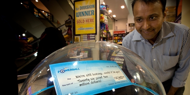 Nilesh Shah owns Willy Wonka where the ticket was sold. The shop has been decked out with signs to get people to check their tickets. Photo / Brett Phibbs
