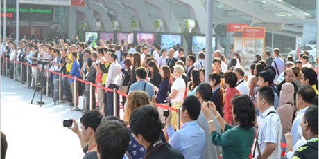 Visitors queue to enter the Canton Trade Fair.