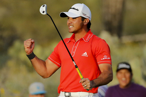Jason Day celebrates on the 23rd hole after winning his championship match against Victor Dubuisson during the Match Play Championship. Photo / AP
