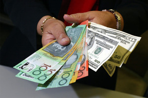 The Australian dollar strengthened and the sharemarket dipped in the minute before yesterday's announcement of a hold in the official interest rates by the Reserve Bank of Australia.