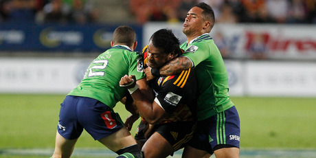 Pauliasi Manu is tackled by Shaun Treeby and Aaron Smith. Photo / Getty