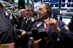 Traders work on the floor of the New York Stock Exchange. File photo / AP