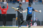 Trent Boult and Kane Williamson celebrate after winning the ICC Cricket World Cup match against Australia at Eden Park on Saturday. Trent Boult and Kane Williamson celebrate after winning the ICC Cricket World Cup match against Australia at Eden Park on Saturday.