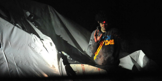 A Massachusetts State Police officer has released never-before-seen photos of Boston bombing suspect Dzhokhar Tsarnaev, bloodied and bruised as sniper teams take aim. Photo / supplied