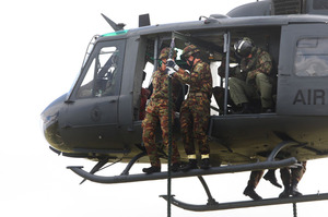Members of the Enhanced Infantry Company prepare to "swarm'' down the ropes dangling. Photo/Bevan Conley