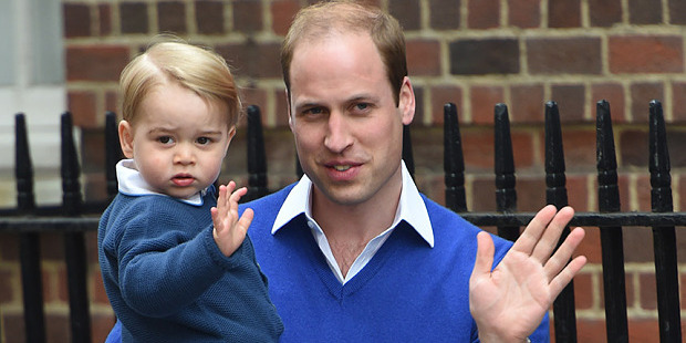 Prince George, in his father's arms, steals the show on a visit to his little sister.