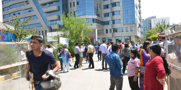 Nepalese people ran out into the streets as a 7.4 magnitude earthquake hit the country. Photo / Getty Images