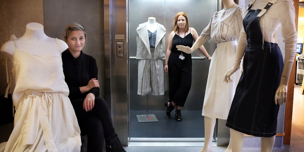 GOING UP: AJ Bradley (left) and Hannah Winter with some of their garments from the Initiation exhibition. The students have internships with Zambesi and Kate Sylvester respectively.PHOTO/STUART MUNRO 100615WCSMFASHION2