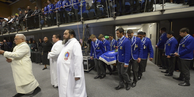 The casket of Jerry Collins is brought in to the service. Photo / Simon Woolf