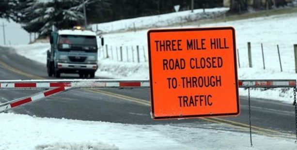 Three Mile Hill Rd was closed to traffic yesterday morning. Photo / Peter McIntosh, ODT