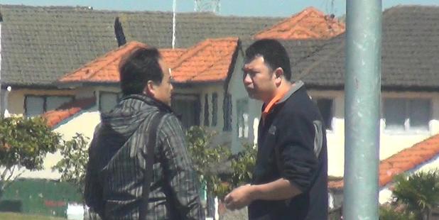 Police surveillance photo of Van Tran (left) meeting Da Wen Shao in a supermarket carpark to hand over a van. Photo / NZ Herald
