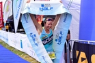 Gina Crawford crosses the finish line to win her second Port of Tauranga title. Photo / George Novak Gina Crawford crosses the finish line to win her second Port of Tauranga title. Photo / George Novak