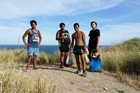 The day-two diving team of Jahnique Whaitiri (left), Justice Nicholson, Zair Hussain and Rawiri Akarana with their paua and crayfish after diving off the coast at Akitio Beach. Photo / Supplied The day-two diving team of Jahnique Whaitiri (left), Justice Nicholson, Zair Hussain and Rawiri Akarana with their paua and crayfish after diving off the coast at Akitio Beach. Photo / Supplied
