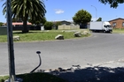 A 22-year-old man was found lying unconscious on the road beside a set of rocks (far right) in Lyn Grove, Papamoa in the early hours of yesterday morning. Photo / George Novak A 22-year-old man was found lying unconscious on the road beside a set of rocks (far right) in Lyn Grove, Papamoa in the early hours of yesterday morning. Photo / George Novak