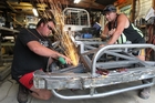 Meeanee Maulers kingpin Brett Loveridge (left), with pit crew member Aussie Holloway, prepares his stockcar for Saturday night's meeting at Meeanee. Photo / Duncan Brown Meeanee Maulers kingpin Brett Loveridge (left), with pit crew member Aussie Holloway, prepares his stockcar for Saturday night's meeting at Meeanee. Photo / Duncan Brown