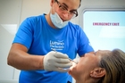 SAY AAAH: Auckland dentist Tony Dey examines patient Rarua Green during free dental treatment in Wairoa yesterday. PHOTO/WARREN BUCKLAND SAY AAAH: Auckland dentist Tony Dey examines patient Rarua Green during free dental treatment in Wairoa yesterday. PHOTO/WARREN BUCKLAND