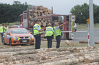 Police at the scene of an accident, where a logging truck tipped on Longlands Road at the Maraekakaho Road roundabout, spilling its load. Photo/Paul Taylor Police at the scene of an accident, where a logging truck tipped on Longlands Road at the Maraekakaho Road roundabout, spilling its load. Photo/Paul Taylor
