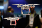 Drones fly at the Autel booth during the International CES. Photo / AP Drones fly at the Autel booth during the International CES. Photo / AP