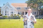WATER'S EDGE: Sally Morrison, with her 11-week-old miniature schnauzers Basil and Rosie, is downsizing. WATER'S EDGE: Sally Morrison, with her 11-week-old miniature schnauzers Basil and Rosie, is downsizing.