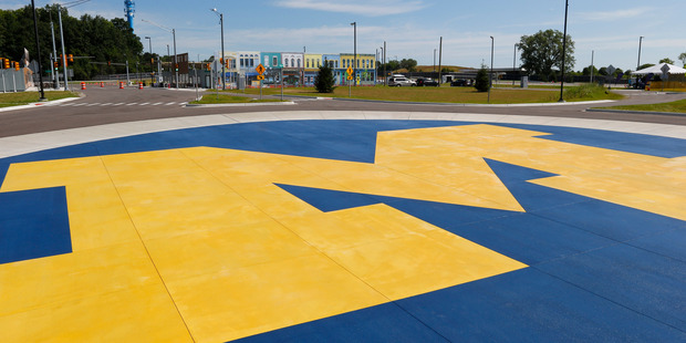 A University of Michigan logo decorates a roundabout at Mcity on its opening day. Photo / AP
