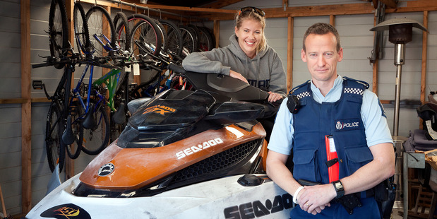 Kylie Laker has been reunited with her stolen jetski. She is pictured with Constable Tim Bonner. Photo / Andrew Warner