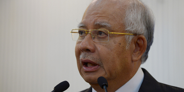 Malaysia's Prime Minister Najib Razak delivers a statement on the missing Malaysia Airlines flight MH370. Photo / Getty Images
