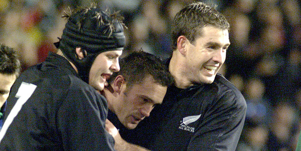 Richard McCaw congratulates Caleb Ralph with Mark Robinson during a test against Ireland in 2002. Photo / Brett Phibbs