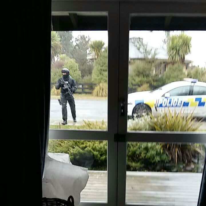 Armed officers carrying out the arrest on a Miro St property. Photo / Supplied