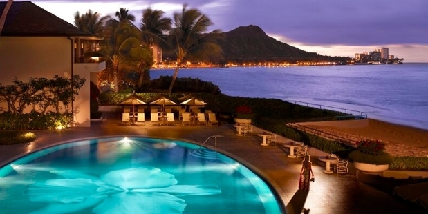 Waikiki Beach's historic Halekulani hotel is known for its pool featuring the cattleya orchid motif. Photo / Barbara Kraft