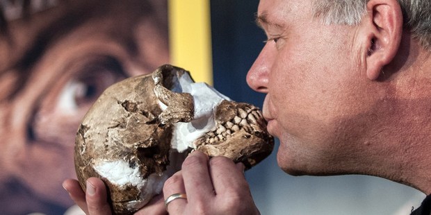 Professor Lee Berger kisses a replica of the skull of a Homo Naledi. Photo / Getty Images