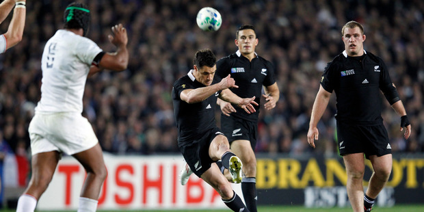 All Black Dan Carter kicks a drop goal. Photo / Dean Purcell