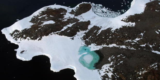 A turquoise lake forms from melting snow near Cape Folger on the Budd Coast, Antarctica. Photo / Getty Images