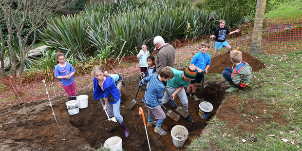 DIGGING UP INFORMATION: Year 4 students learn about maths and measurements during a digging exercise. Photo/George Novak