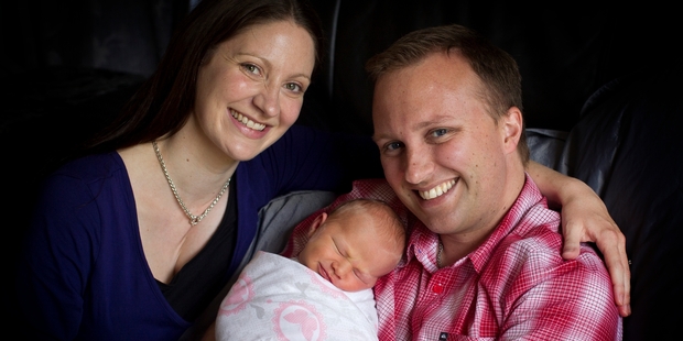 Hannah and Jared Noel with baby Elise, the child for whom he wrote his book.