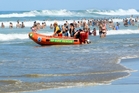 Big numbers took to the big cool seas without incident to escape the heat, although some swimmers were helped in after drifting away from the flags. Photo / Warren Buckland Big numbers took to the big cool seas without incident to escape the heat, although some swimmers were helped in after drifting away from the flags. Photo / Warren Buckland